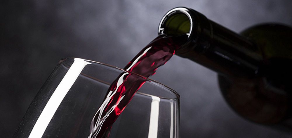 Red wine being poured into a glass